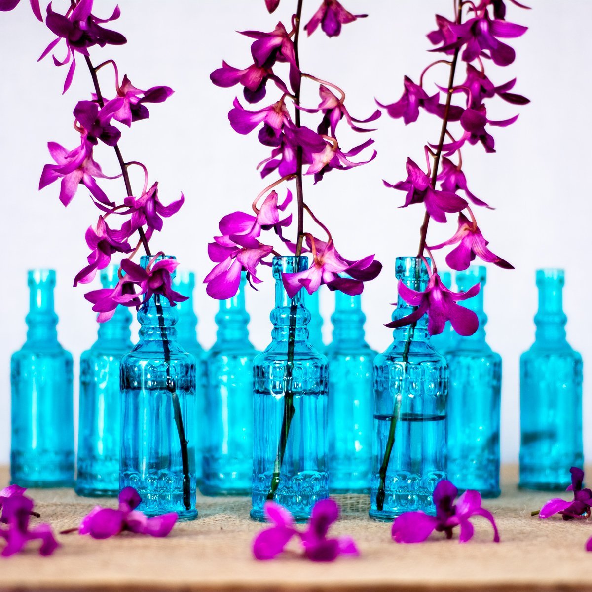 https://www.paperlanternstore.com/cdn/shop/products/calista-vintage-glass-bottle-set-flower-vases-colorful-6-image-1_14091d4e-d93e-4299-8b3b-507a30ab285f.jpg?v=1616502568